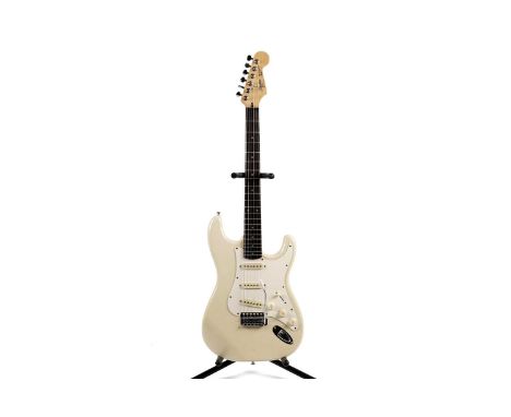 A Fender Squier Stratocaster, made in Korea, with rosewood fretboard, cream finish.