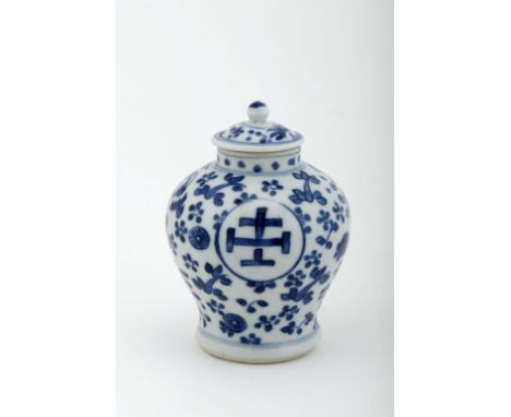 A pot with cover, Chinese export porcelain, blue decoration "Flowers", two circular reserves with blue decoration "Insignia a