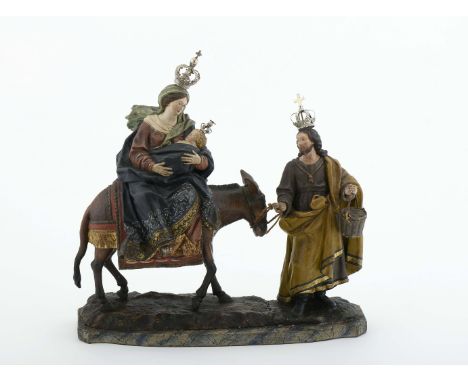 The flight into Egypt, group of carved, polychrome and gilt wood sculptures, silver crowns, Portuguese, 18th C., minor faults