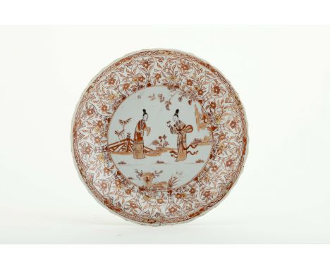 A large dish with a wavy flap and scalloped edge, Chinese porcelain, rouge-de-fer and gilt decoration "Garden with two female