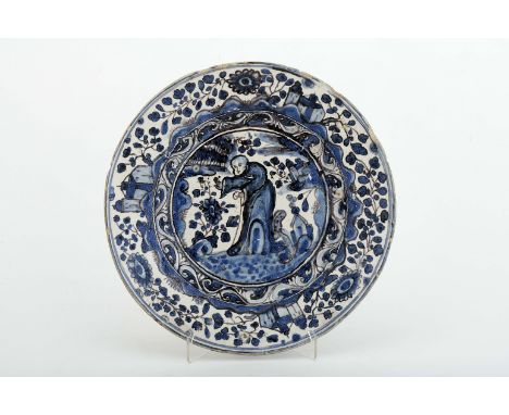 A plate, faience, blue and vinous «Small drawing» decoration "Chinese figure with cane", central band with «Baroque band deco