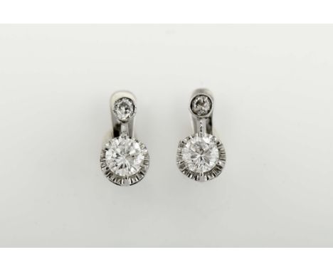 A pair of earrings, 800/1000 white gold, set with 2 antique brilliant cut diamonds weighing approximately 0.26 ct. and 2 larg