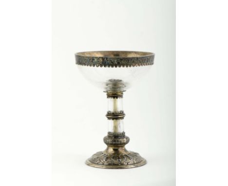 A cup, Renaissance style, carved rock crystal stem and cup, silver base, edge and rings with decoration en relief and engravi