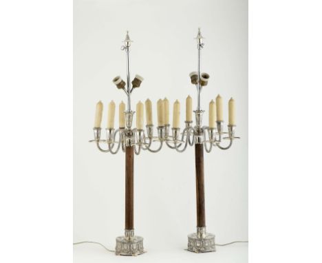 A pair of seven-light candelabra, Brazilian rosewood stems, 833/1000 silver base and arms with decoration en relief "plant mo