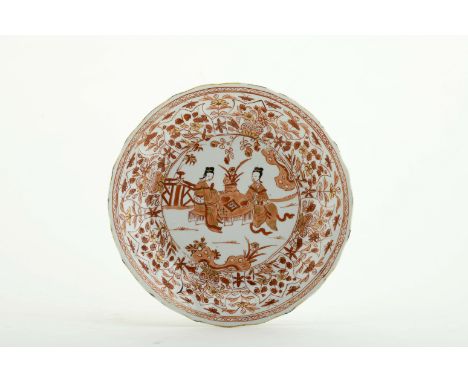 A plate with wavy flap, Chinese porcelain, rouge-de-fer, brown and gilt decoration "Female figures playing", back of flap wit