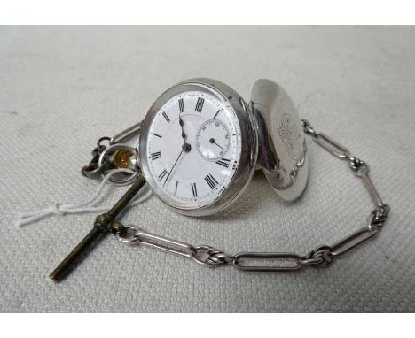 A ladies silver open face Fob Watch with plain white enamel dial, subsidiary seconds sweep dial on single albert with long li