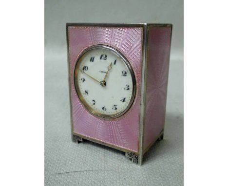 A small early 20th century Art Deco silver Cabinet or Desk Clock by Asprey, rectangular form on engraved bracket style feet, 