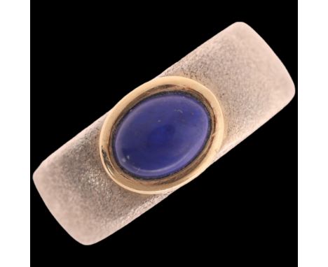 SUSANNE FRIIS BJORNER - a Danish modernist sterling silver lapis lazuli band ring, textured decoration, with silver-gilt moun