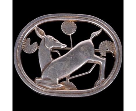 GEORG JENSEN - an Art Nouveau style Danish sterling silver kneeling deer brooch, designed by Arno Malinowski, model no. 256, 