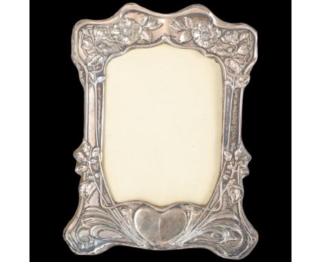 An Art Nouveau Edwardian silver-fronted photo frame, Henry Matthews, Birmingham 1902, relief embossed heart and floral decora