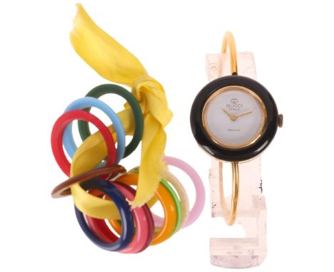 GUCCI - a lady's Vintage gold plated quartz bangle wristwatch, white dial with pencil hands and interchangeable bezels, 1 jew
