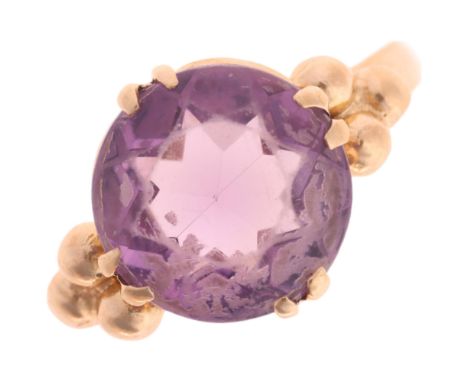 A 9ct gold single stone amethyst dress ring, maker EFC, Birmingham 1970, claw set with round-cut amethyst, setting height 11.