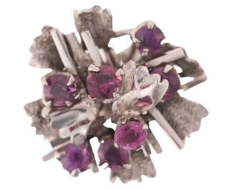 An 18ct white gold ruby abstract cocktail ring, circa 1960s, setting height 20.5mm, size M, 7g . Condition Report:All stones 