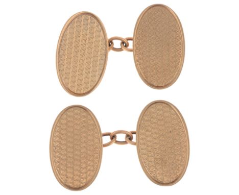 A pair of Art Deco 9ct gold oval cufflinks, maker OP, Birmingham 1930, engine turned decoration, 17.9mm, 4.3g . Condition Rep