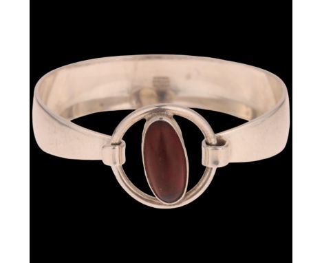 NIELS ERIK FROM - a Danish modernist sterling silver amber eye torque bangle, setting height 24.4mm, internal circumference 1