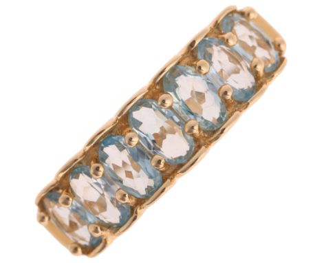 A 14ct gold blue topaz and diamond half hoop ring, set with oval mixed-cut topaz, setting height 6.2mm, size N, 3.6g . Condit