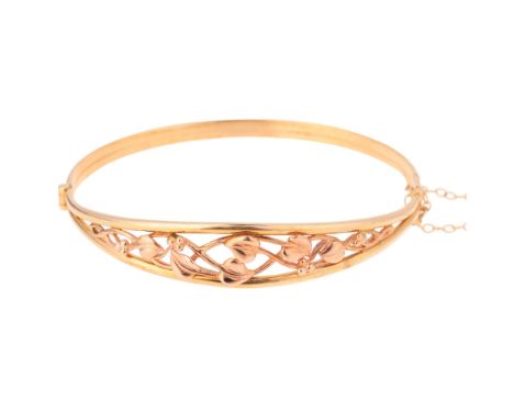 CLOGAU - a 9ct two-colour Welsh gold 'Tree Of Life' hinged bangle, setting height 11.5mm, internal circumference 17cm, 10.7g,