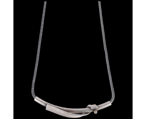 A Danish modernist oxidised and gilded sterling silver and cubic zirconia abstract pendant necklace, on oxidised sterling fox