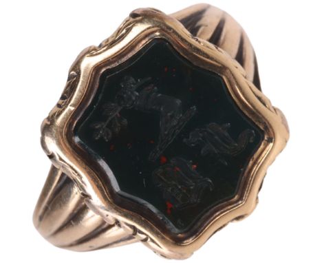 An Antique 9ct gold bloodstone seal signet ring, intaglio carved with hand holding olive branch emblem and initials FB, in sh
