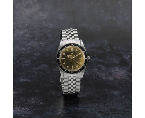 Rolex. A fine and rare stainless steel automatic bracelet watch with gilt dialModel: Turn-o-GraphReference: 6202Date: Purchas