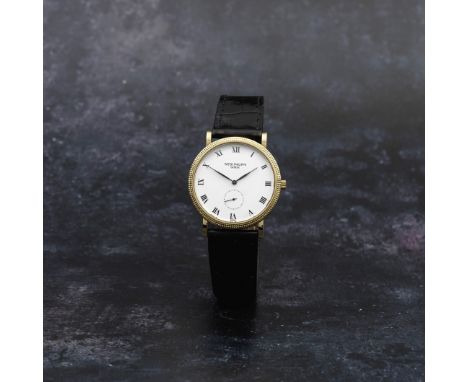 Patek Philippe. An 18K gold manual wind wristwatchModel: CalatravaReference: 3919Date: Circa 1995Movement: 18-jewel Cal.215 m