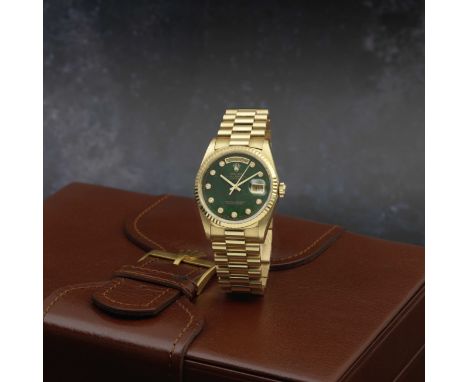 Rolex. A fine and rare 18K gold automatic calendar bracelet watch with diamond set bloodstone dialModel: Day-DateReference: 1