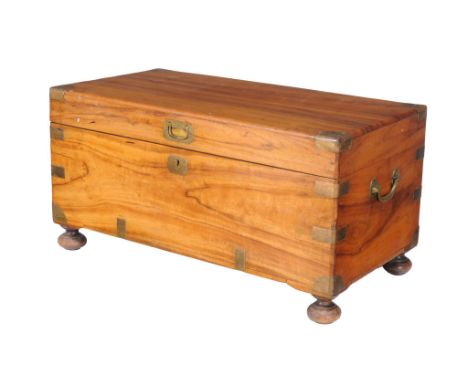  A camphor and brass bound trunk,   second half 19th century, of small proportion, on turned bun feet,  37cm high, 73cm wide,