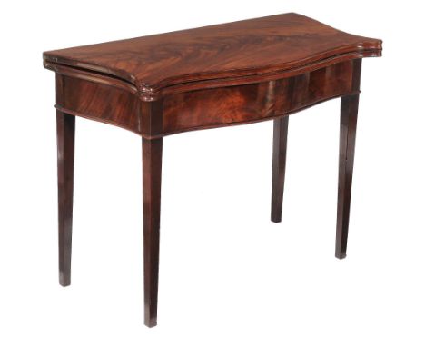  A George III mahogany card table  , circa 1790, of serpentine outline, with a baise inset playing surface above a blind frie