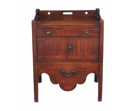  A George III mahogany tray top bedside commode  , circa 1800, the pierced gallery above a frieze drawer, pair of cupboard do