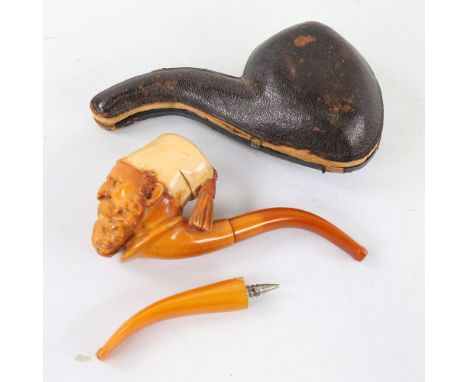 A 19th century carved Meerschaum pipe in the form of an Arab man wearing a Fez, original case with spare amber mouthpieceSlig