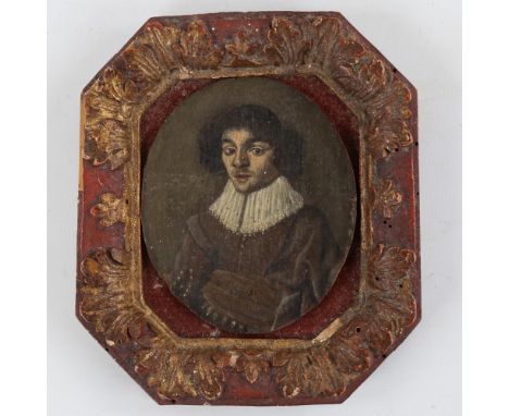 An Antique miniature oil on panel, portrait of a gentleman wearing a ruff, indistinct handwritten paper label on reverse, pan
