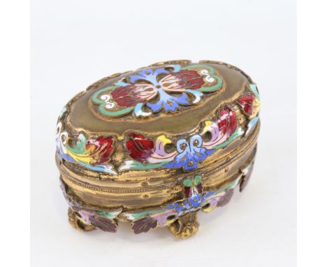 A 19th century French gilt-brass and champleve enamel jewel casket of oval form, allover applied enamel leaves, on ball feet,