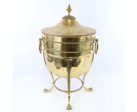 An Edwardian brass urn-shaped coal scuttle, with cast applied decoration and ring handles, height 56cmVery light denting thro