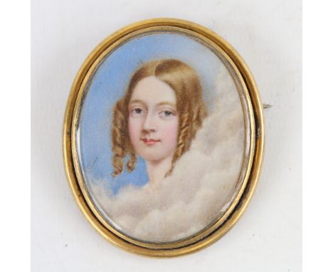 A 19th century miniature painting on ivory, portrait of a young woman with ringlets in her hair, unsigned, in gilt-metal fram