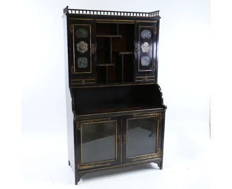 A Victorian Aesthetic Movement cabinet, attributed to Collinson & Lock, gilded and ebonised wood, the upper part having Orien