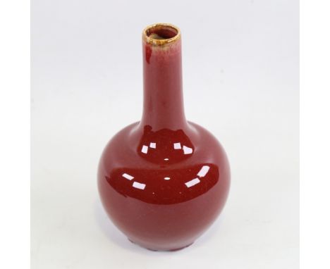 A Chinese sang de boeuf glaze porcelain bottle vase, height 19cmGlaze and ceramic is chipped all around the foot, probably du