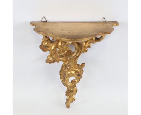 A carved giltwood Florentine shelf bracket with acanthus support, probably early 20th century, height 23cm, width 20cmNo chip