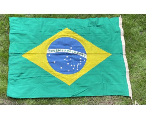 [BRAZIL]: A World War II date national flag of Brazil (measuring 71.5 x 50.5”), the Verde e amarela featuring a blue disc dep