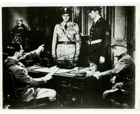 WAYNE JOHN: (1907-1979) American Actor, Academy Award winner. Signed and inscribed 10 x 8 photograph of Wayne standing in a f