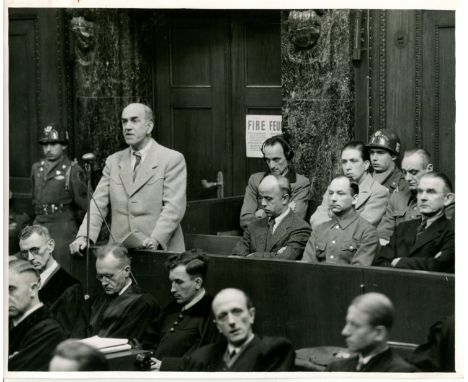 [NUREMBERG TRIALS - THE POHL TRIAL]: A group of eight original 10 x 8 United States Army public relations photographs, unsign