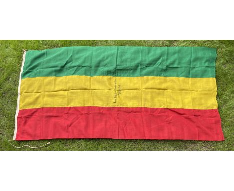 [ETHIOPIA]: A World War II date national flag of Ethiopia (measuring 108 x 53”) of green, gold and red tricolour, manufacture