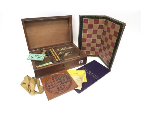 A Late XIX century Games Compendium, the plain mahogany rectangular box containing a chess set, draughts, marbles and solitai
