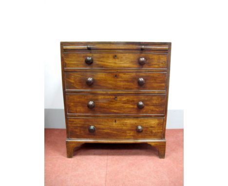An Early XIX Century Mahogany Bachelor's Chest, with caddy top, brushing slide over four long drawers, on bracket feet, 95cm 