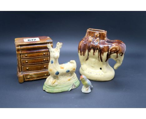 A Mid XIX Century Stoneware Pottery Money Box, part decorated in treacle glaze and modelled in the form of an elephant, mould