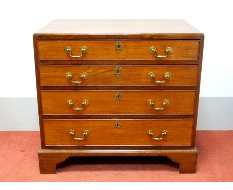 A Late XVIII Century Mahogany Chest of Drawers, the top with small moulded edge, upper drawer fitted with drawer dividers, le