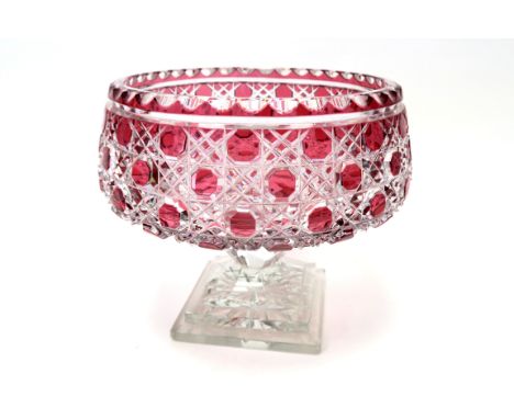 A Mid XX Century Cut Glass Ruby Flashed Bowl, of circular form, raised on a knopped stem and stepped square base, decorated i