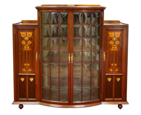 A Shapland &amp; Petter Ltd. Art Nouveau Mahogany Bow Fronted Display Cabinet, the low back with presentation plaque, convex 