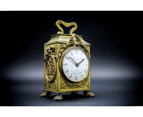 L. Leroy & Co., Paris Miniature Gilt-Brass Carriage Timepiece, the engraved case with ribbon mounts and raised on paw feet, t