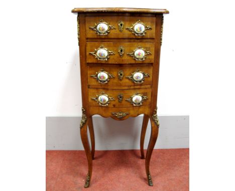 An Early XX Century French Walnut Rococco Style Serpentine Small Commode, with crossbanded top, four drawers with ormolu hand