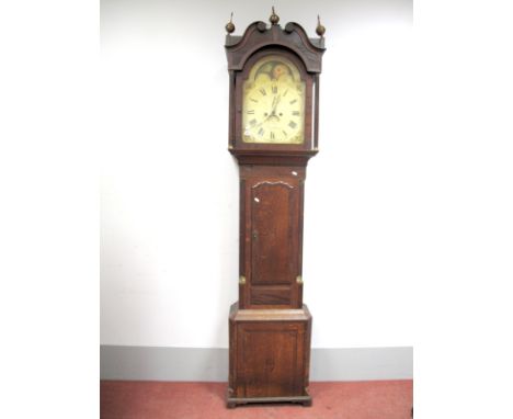 An XVIII Century Oak and Mahogany Eight-Day Longcase Clock, the arched moonface white dial with Roman numerals and two subsid